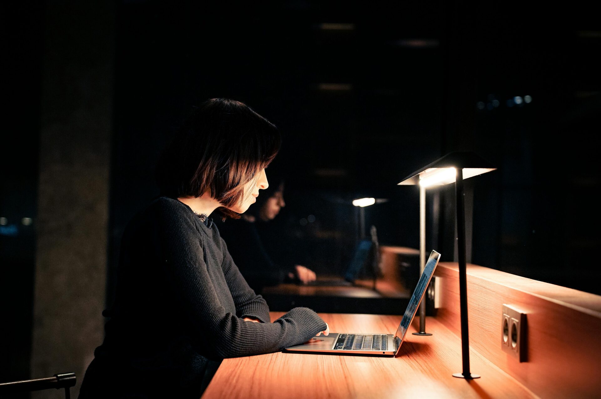 A woman works from home on a laptop